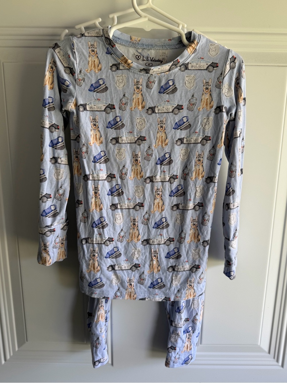 Lev Bamboo pajama set features a police-themed print with dogs and cruisers 4T